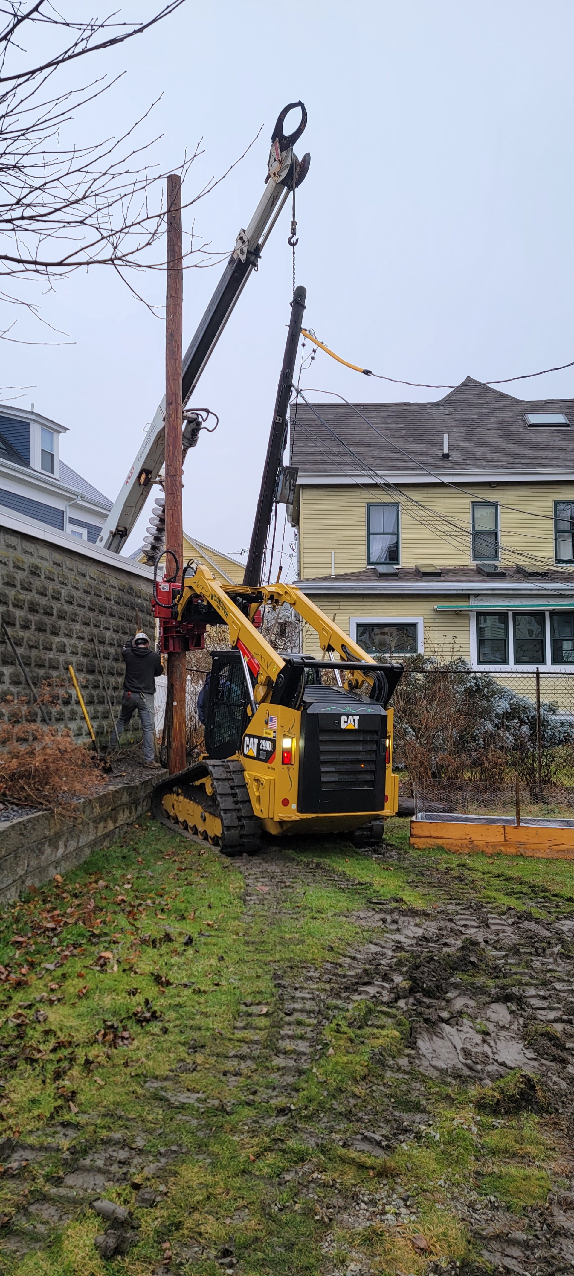 CAT 299D specialty pole setting — location 1
